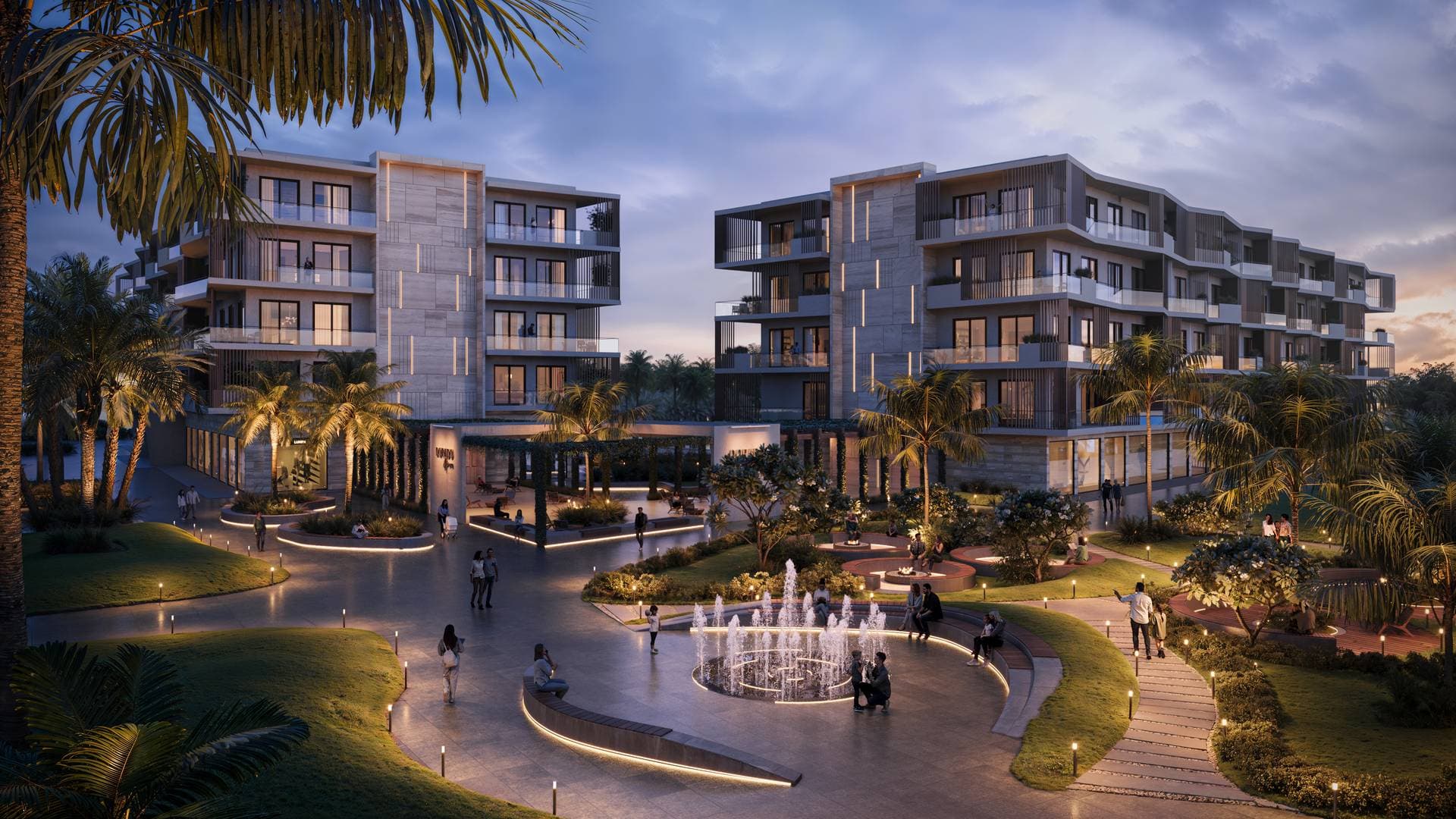 Dorado Grove residential buildings at dusk with warm lighting and tropical landscaping