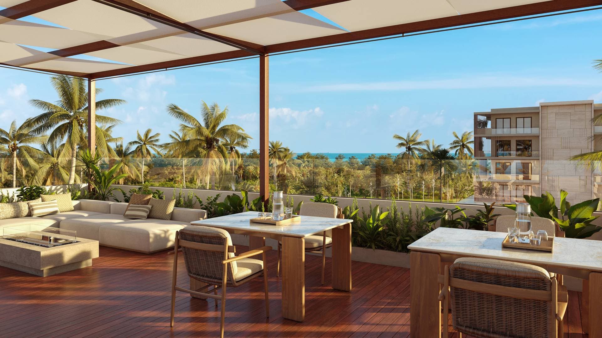 Rooftop food and beverage terrace with ocean views and tropical landscaping at Dorado Grove